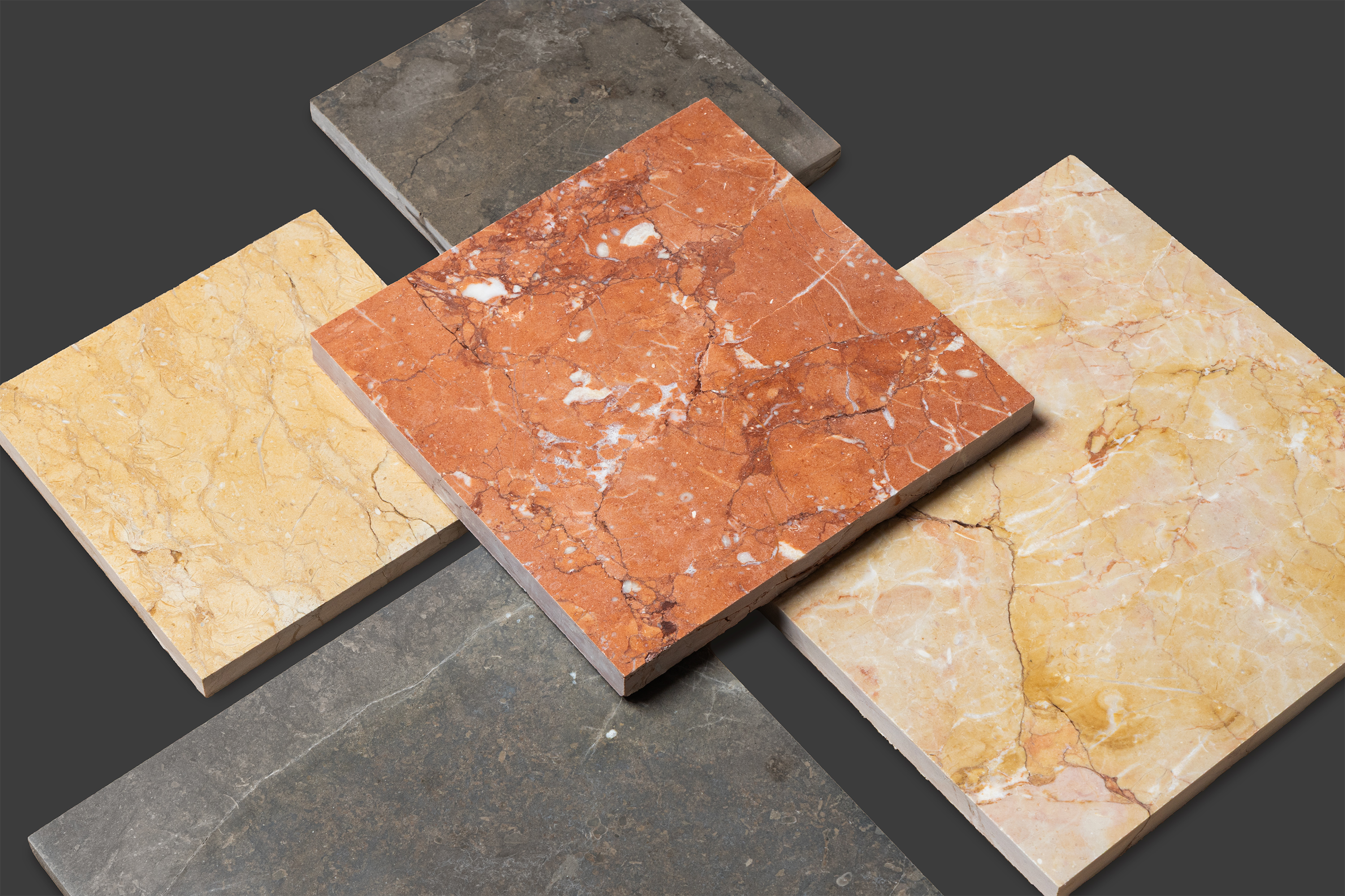 Grouped limestone sample presentation showing Rosso, Giallo, and grey stone surfaces